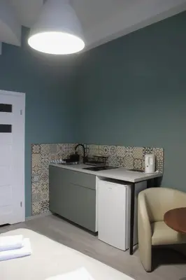 a kitchen with a stove and a counter top at EURO-ROOM in Kraków