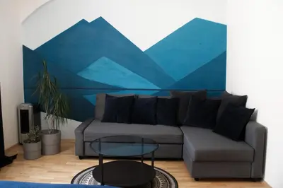 a living room with a couch and a table at EURO-ROOM in Kraków