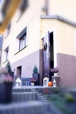 a house with a door and a pumpkin in front of it at Noclegi w gorcach in Ponice