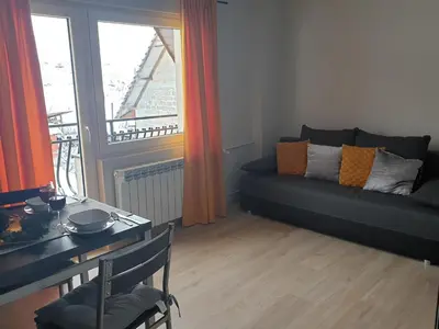 a living room with a couch and a table at Noclegi w gorcach in Ponice
