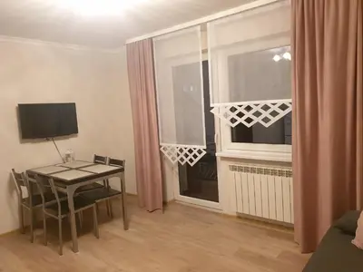 a living room with a table and a window at Noclegi w gorcach in Ponice