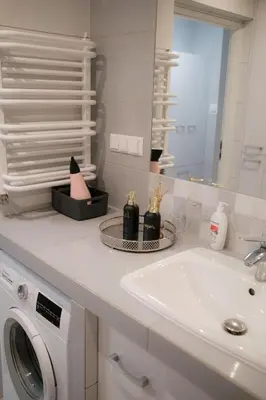 a kitchen with a table and chairs and windows at Fredry 15F in Kraków