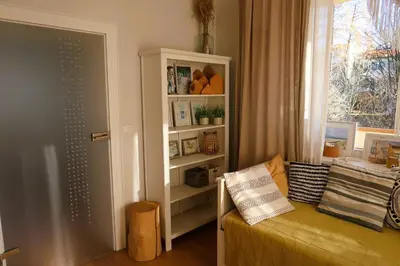 a living room with a couch and a window at Apartament Joanna in Rabka