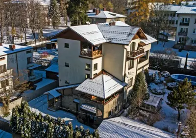 an aerial view of a house with a snow covered roof at Apartament Joanna in Rabka