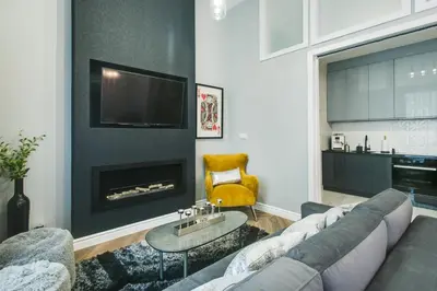 a bathroom with a shower and a toilet and a sink at Kings City - Zyblikiewicza 14 apartment in Kraków
