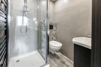 a bathroom with a shower and a toilet and a sink at AgroPrzystań in Zubrzyca Górna