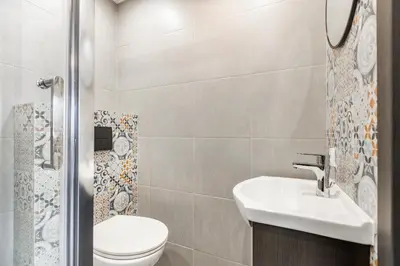 a bathroom with a toilet and a sink at AgroPrzystań in Zubrzyca Górna