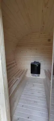 a sauna with a tv in a wooden room at Domki na Mosornym in Zawoja