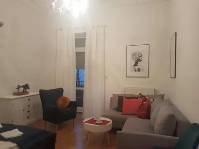 a living room with a couch and a chair at Zakamarki in Kraków