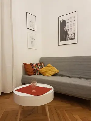 a living room with a couch and a coffee table at Zakamarki in Kraków