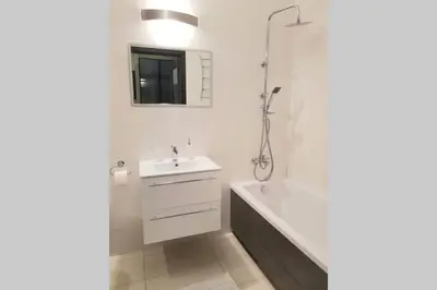 a white bathroom with a sink and a shower at Luxury KINGS RESIDENCE 50m2 2 pok. Downtown Dobrego Pasterza PIĘKNY in Kraków