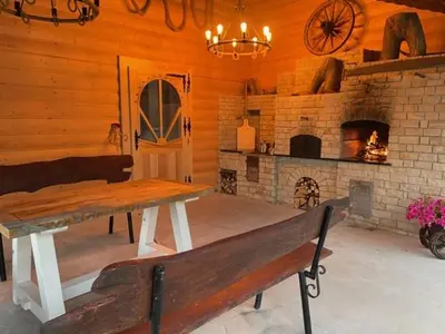 a wooden room with a bench and a fireplace at U Kowola - Gospodarstwo Agroturystyczne in Węglówka