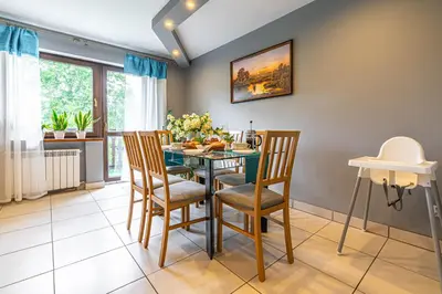 a dining room with a table and chairs at U Kowola - Gospodarstwo Agroturystyczne in Węglówka