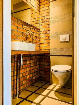 a bathroom with a toilet and a sink at Zwierzyniecka Lofts with Patio and Air Conditioning, Cracow city heart Old Town in Kraków