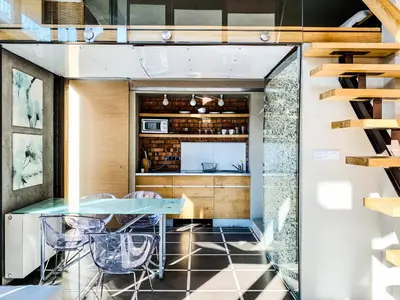 a kitchen with a glass table and chairs at Zwierzyniecka Lofts with Patio and Air Conditioning, Cracow city heart Old Town in Kraków
