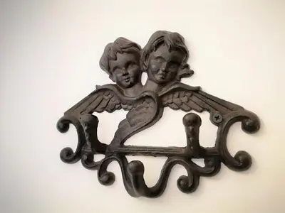 a metal object with two people in a mirror at ZamStudio Kraków Zamenhofa 4 in Kraków
