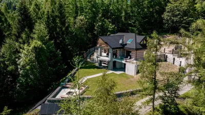 an aerial view of a house in the woods at Domki PRemium in Zawoja