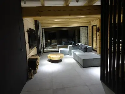 a living room with couches and a coffee table at Domki PRemium in Zawoja