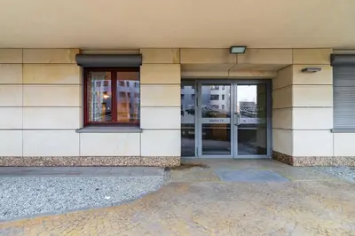 an entrance to a building with glass doors at Premium Apartment Ludwinowska Kraków by Noclegi Renters in Kraków