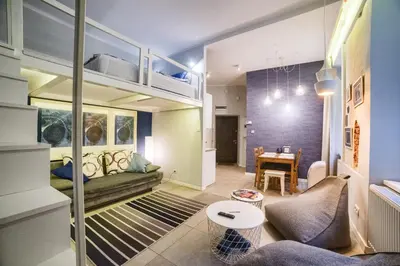 a living room with a couch and a table at Quiet & Comfortable Old Krakow Apartment in Kraków