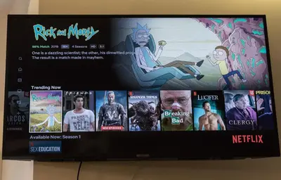 a tv screen with a bunch of movies on it at Quiet & Comfortable Old Krakow Apartment in Kraków