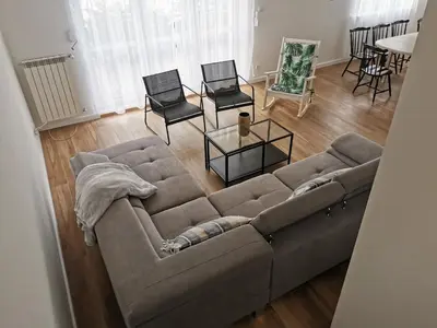 an overhead view of a living room with a couch and chairs at Hygge House in Zator