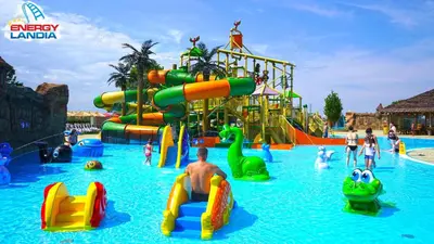 a large water park with a water slide at Hygge House in Zator