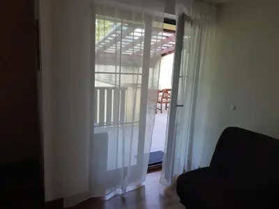 a view of a sliding glass door with a balcony at APARTAMENT LUCYNA in Rabka