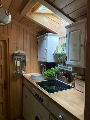 a kitchen with a sink and a counter top at Rożnów domek pod Zamkiem in Rożnów