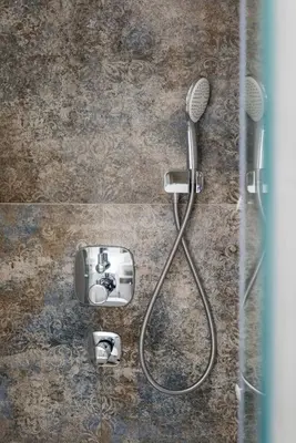 a shower with a blow dryer and a sink at Deluxe Apartment Rakowicka 15 WAWELOFTS in Kraków