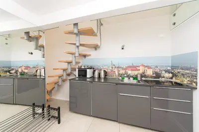 a kitchen with a view of the city at Exclusive Loft in the Main Square A/C p4you pl in Kraków