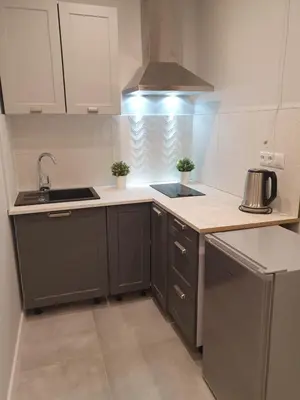 a kitchen with a sink and a stove top oven at apartament in Kraków