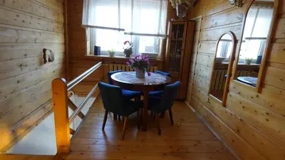 a dining room with a table and chairs in a cabin at Zawoja Dom Czatoża in Zawoja