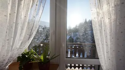 a window with a view of a snow covered yard at Zawoja Dom Czatoża in Zawoja