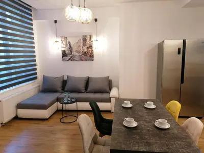 a living room with a couch and a table at Kazimierz Old Town Apartments in Kraków
