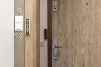an open door with the number on it at Nadwiślańska 5 Apartments Kraków by Noclegi Renters in Kraków