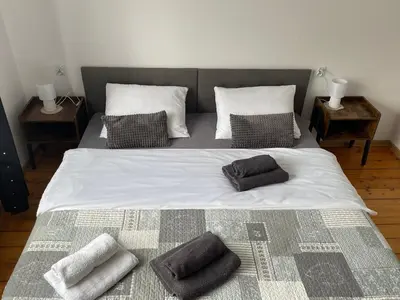 a large bed with two pillows on top of it at Dolce Vita in Mszana Dolna