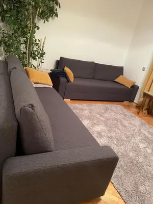 a gray couch sitting in a living room at Dolce Vita in Mszana Dolna
