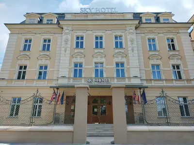 a large tan building with the sky hotel at Sky Hotel Kraków in Kraków