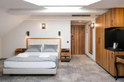 a bedroom with a bed and a flat screen tv at Sky Hotel Kraków in Kraków