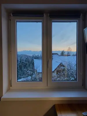 a window with a view of a snow covered field at Nocleg pod Turbaczem in Nowy Targ