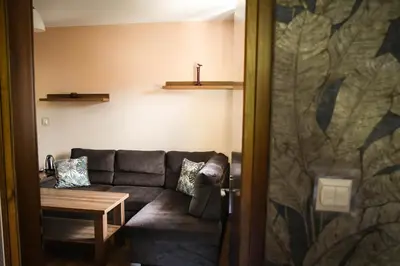 a living room with a couch and a table at Pensjonat Zdrojowy in Rabka