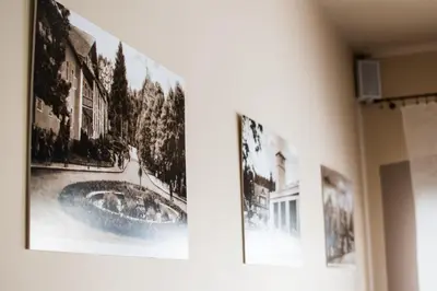 a group of pictures hanging on a wall at Pensjonat Zdrojowy in Rabka