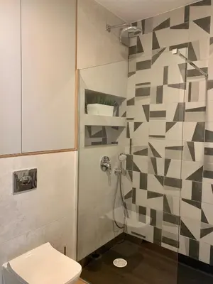 a bathroom with a toilet and a shower at Apartamenty Parkowe B5 in Oświęcim