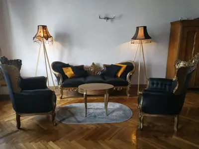 a living room with a couch and two chairs and a table at Main Square 18 King Apartament in Kraków