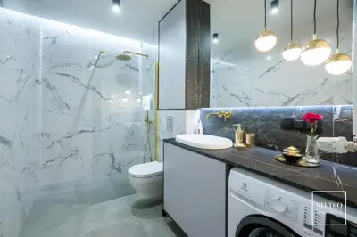 a bathroom with a toilet and a sink and a shower at Exclusive Gold Apartment in Kraków
