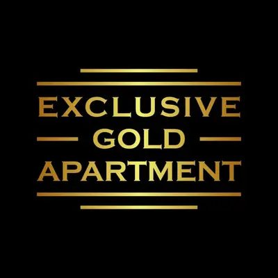 a yellow sign that reads exclusive gold apartment at Exclusive Gold Apartment in Kraków