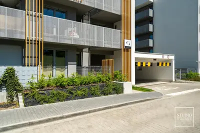 an empty street in front of a building at Exclusive Gold Apartment in Kraków