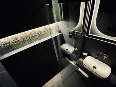 a bathroom with a white sink and a mirror at Kochanowskiego Apartment - Topolove Rooms & Apartments in Kraków