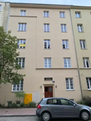 a car parked in front of a building at Na Skałce Apartment in Kraków
